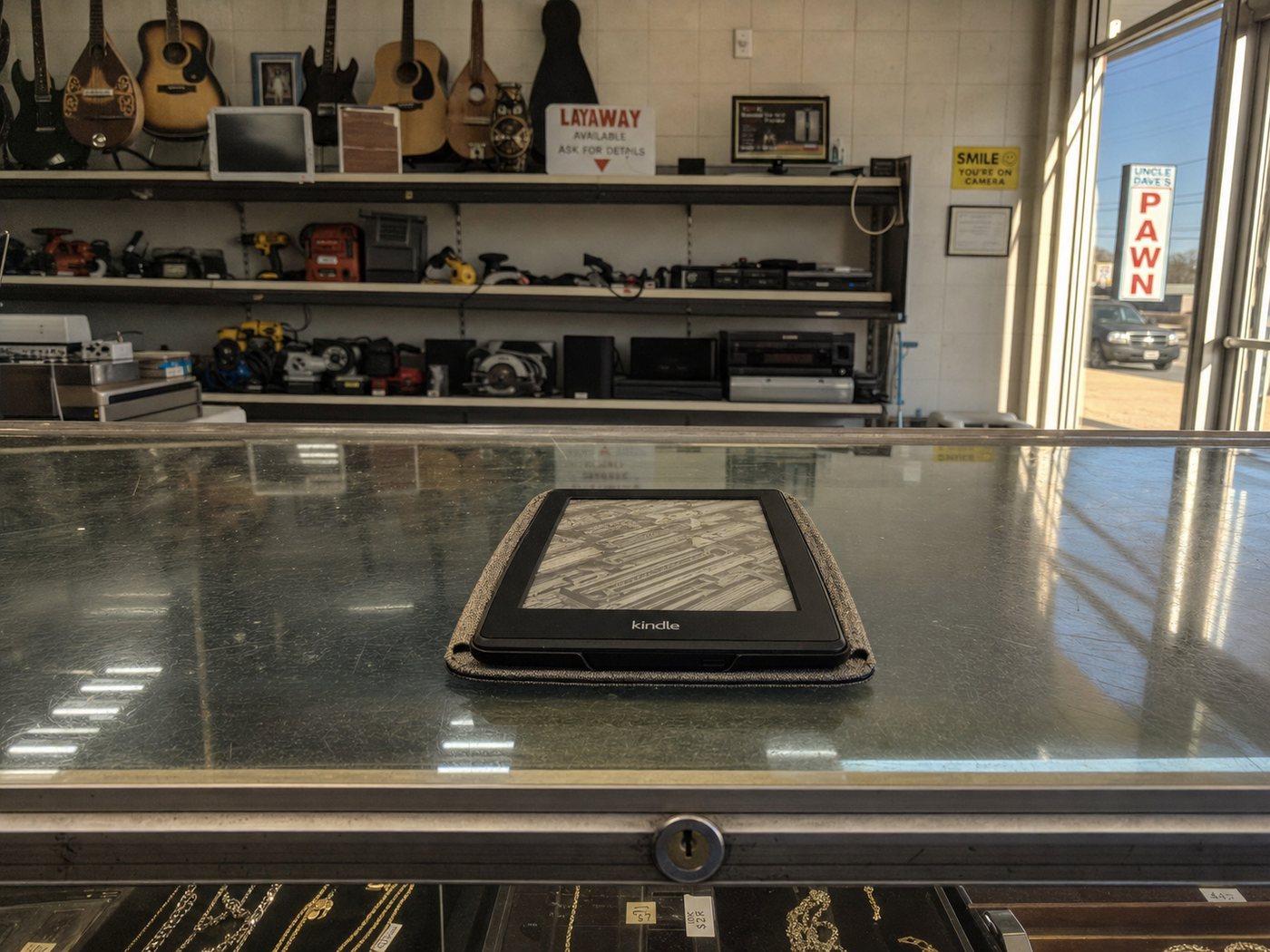 An e-reader lying on a pawn shop counter.